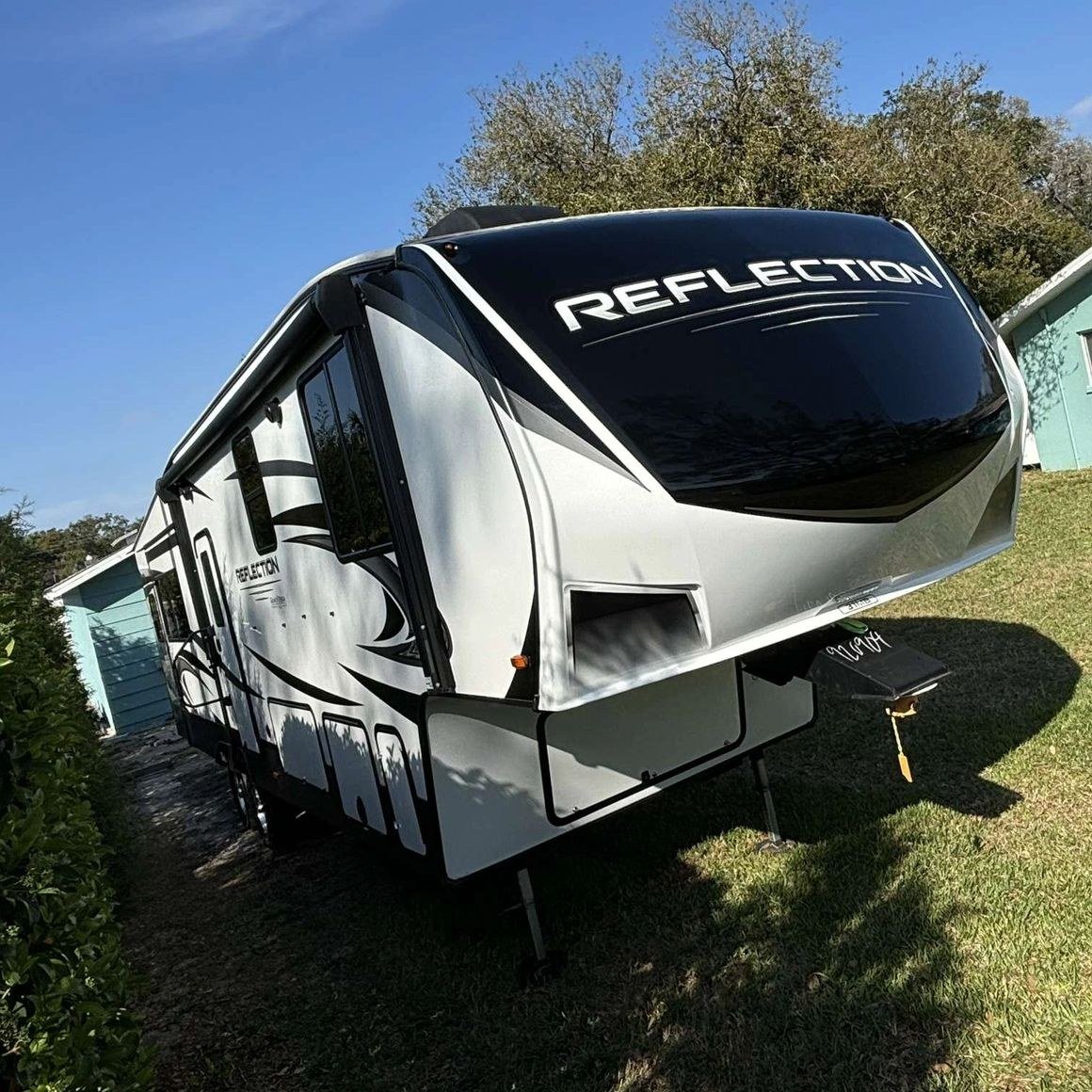 A white Reflection travel trailer