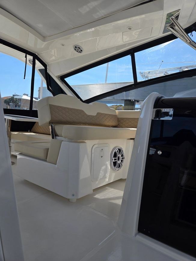 A boat's teak cockpit and helm, finished